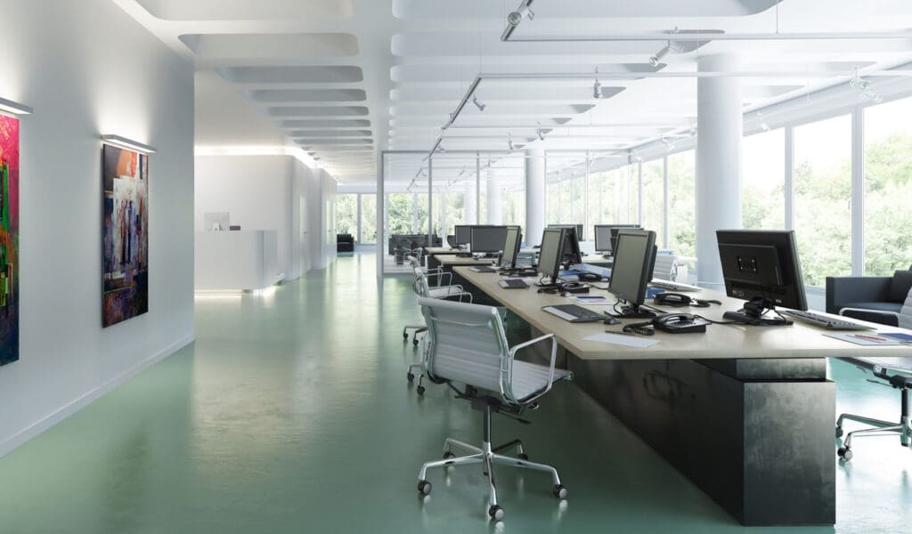 An office scene with a large desk and artwork on the walls, prompting discussion on disruption during live refurbishments.