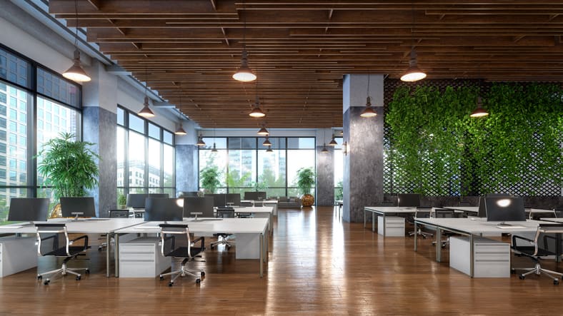 Modern open-plan office design and fit out featuring white workstations, black task chairs, a timber slatted ceiling, pendant lighting, floor-to-ceiling windows and a large green living wall.
